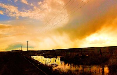 Scenic view of dramatic sky during sunset