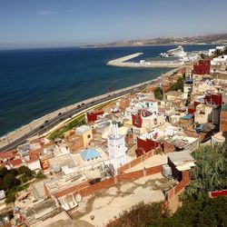 High angle view of cityscape by sea