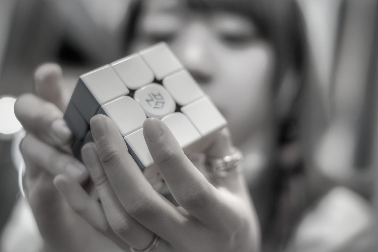 CLOSE-UP OF WOMAN WITH TOY