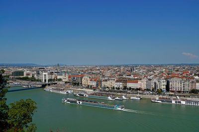 High angle view of river amidst buildings in city