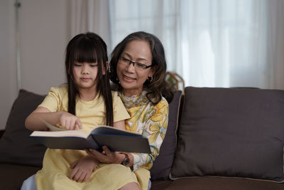 Happy family using laptop at home