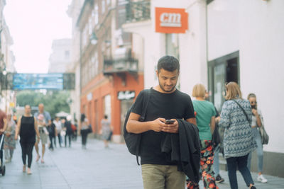 People walking on street in city