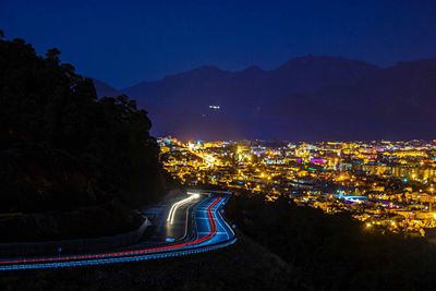 Illuminated cityscape at night