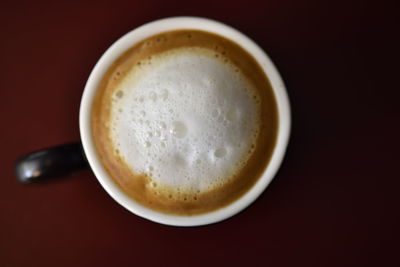 High angle view of coffee cup on table