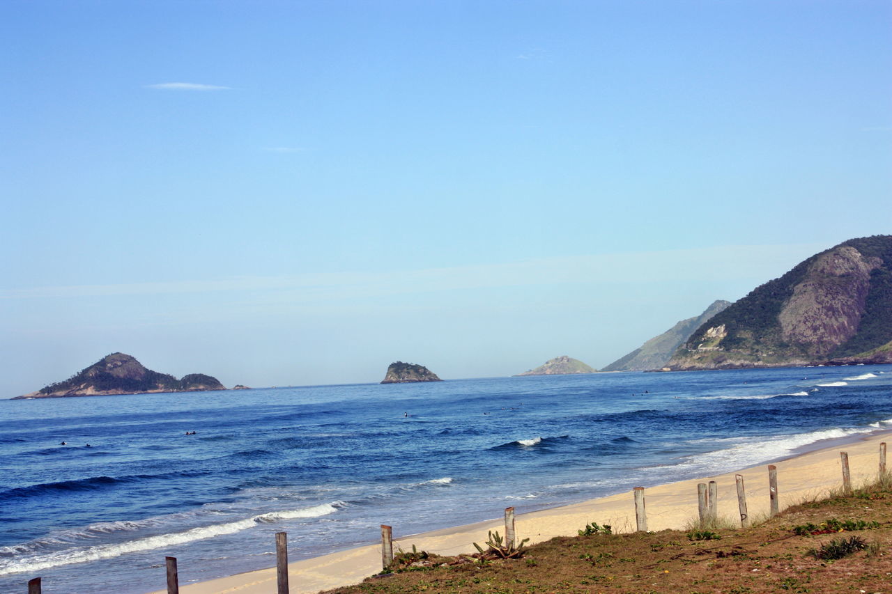 sea, beach, water, nature, beauty in nature, tranquility, tranquil scene, sand, blue, scenics, sky, day, outdoors, no people, horizon over water, clear sky