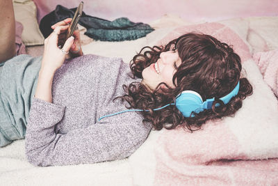 Woman listening music at home