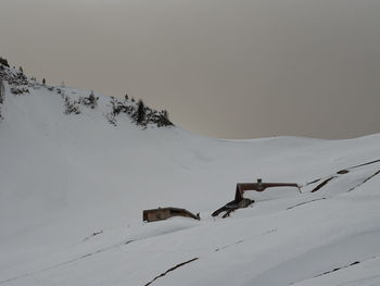 Scenic view of snow covered mountain against sky