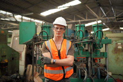 Young man working in factory