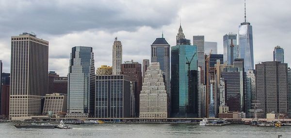 Modern buildings in city against sky