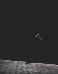 Man with umbrella at night