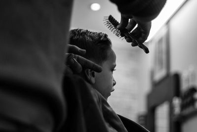 Close-up of child in barber shop