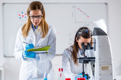 Scientists working in laboratory