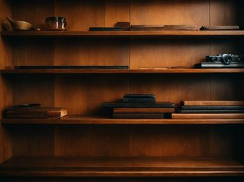 Close-up of wooden shelf at home