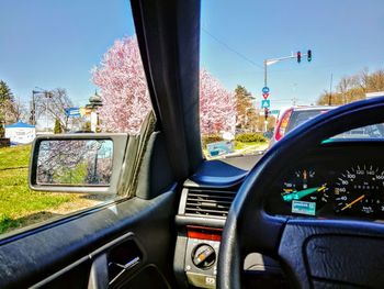 Vehicles on road seen through car windshield