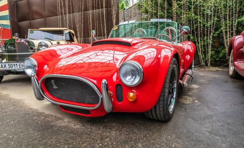 Red vintage car in city