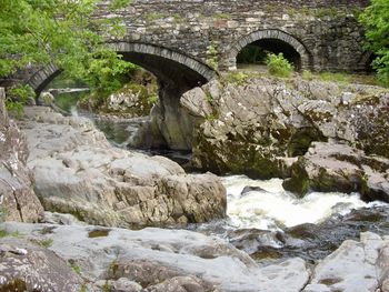 Old stone bridge over river