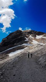 Scenic view of snowcapped mountain against blue sky