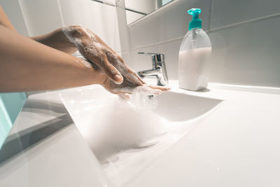 Midsection of man in bathroom at home