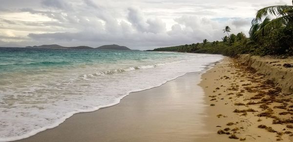 Scenic view of beach against sky