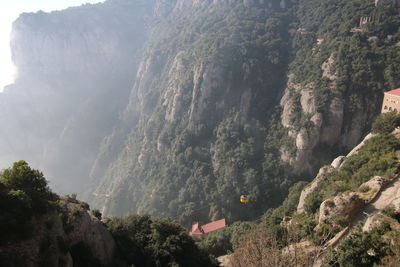 High angle view of trees and mountains against sky