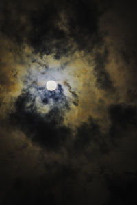 Low angle view of moon in sky at night