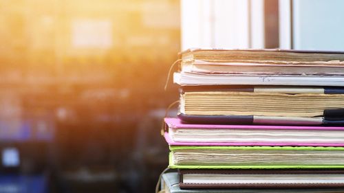 Close-up of stacked books on table