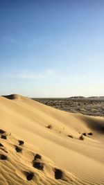 Scenic view of desert against sky