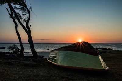 Scenic view of sea against clear sky during sunset