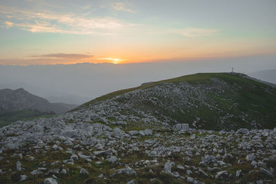 Scenic view of landscape against sky during sunset