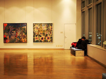 People sitting on table in illuminated room