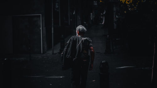 Rear view of man walking in city