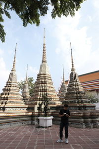Full length of a temple against building