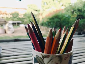 Close-up of colored pencils on container