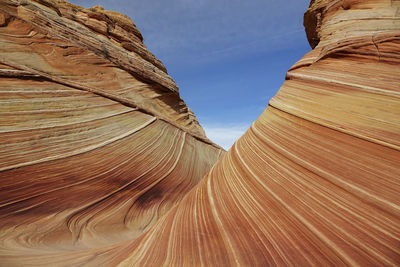 Low angle view of rock formations against sky