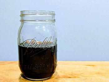 Close-up of glass jar on table