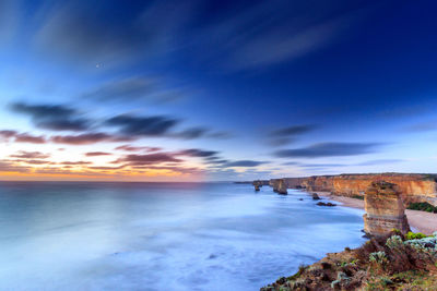 Scenic view of sea against cloudy sky