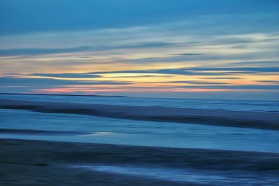 Scenic view of sea at sunset