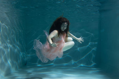 Woman swimming in pool