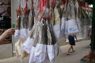 Clothes hanging in store for sale at market