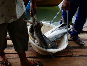 Low section of people at fish market