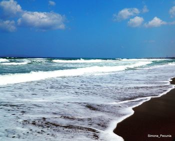 Scenic view of beach against sky