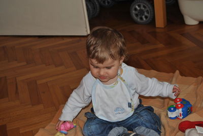 Cute boy playing at home