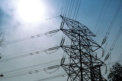 Low angle view of electricity pylon against sky