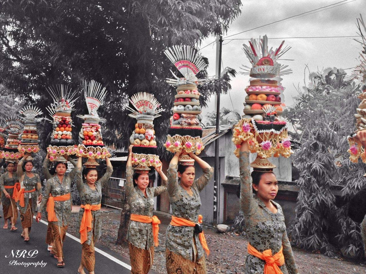 tree, building exterior, built structure, sky, architecture, tradition, religion, day, outdoors, spirituality, cultures, place of worship, lifestyles, art and craft, standing, temple - building, human representation