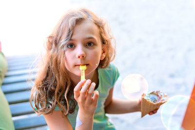 Portrait of a girl holding ice cream