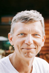 Close-up portrait of smiling senior man