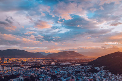 Aerial view of townscape against sky during sunset