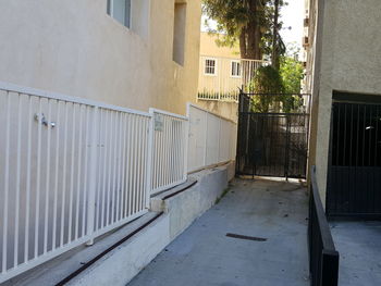 Empty alley amidst buildings in city