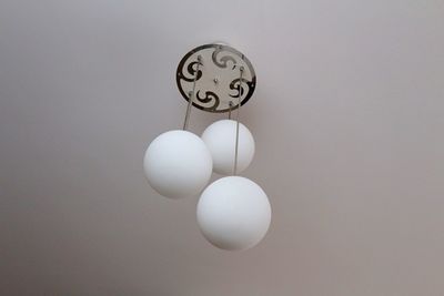 Close-up of electric lamp against white background