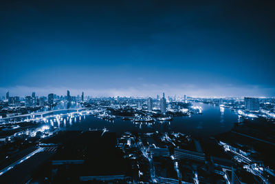 High angle view of illuminated buildings in city at night